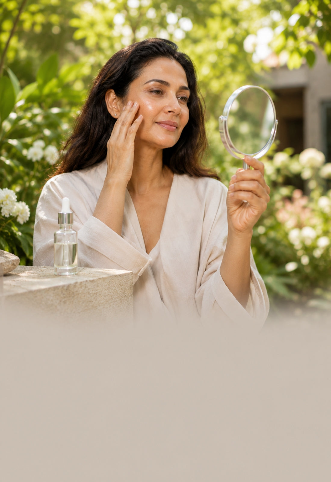 Woman applying skincare product outdoors with a mirror and bottle.